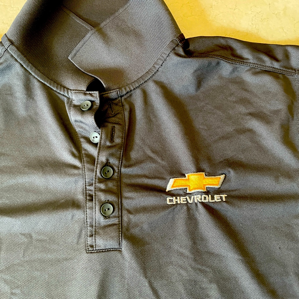 Chevrolet Branded OGIO gray lightweight polo. Size medium. Minor signs of wear.